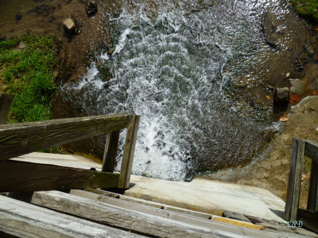 Looking down where the water flows back out of the wheel area.