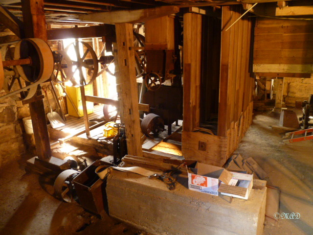 The basement, just above where the water flows through to turn the turbine wheels.