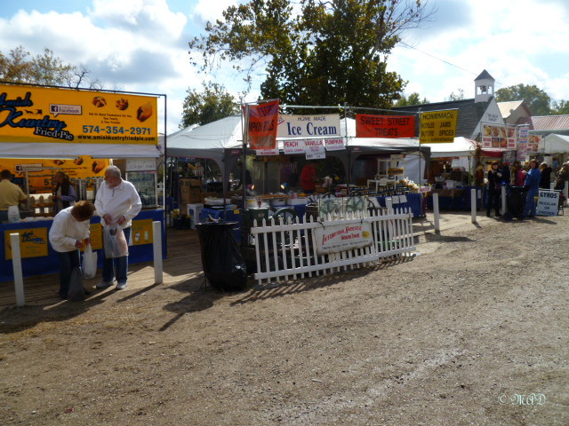 Ice cream prepared with an old antique engine providing the churning power.